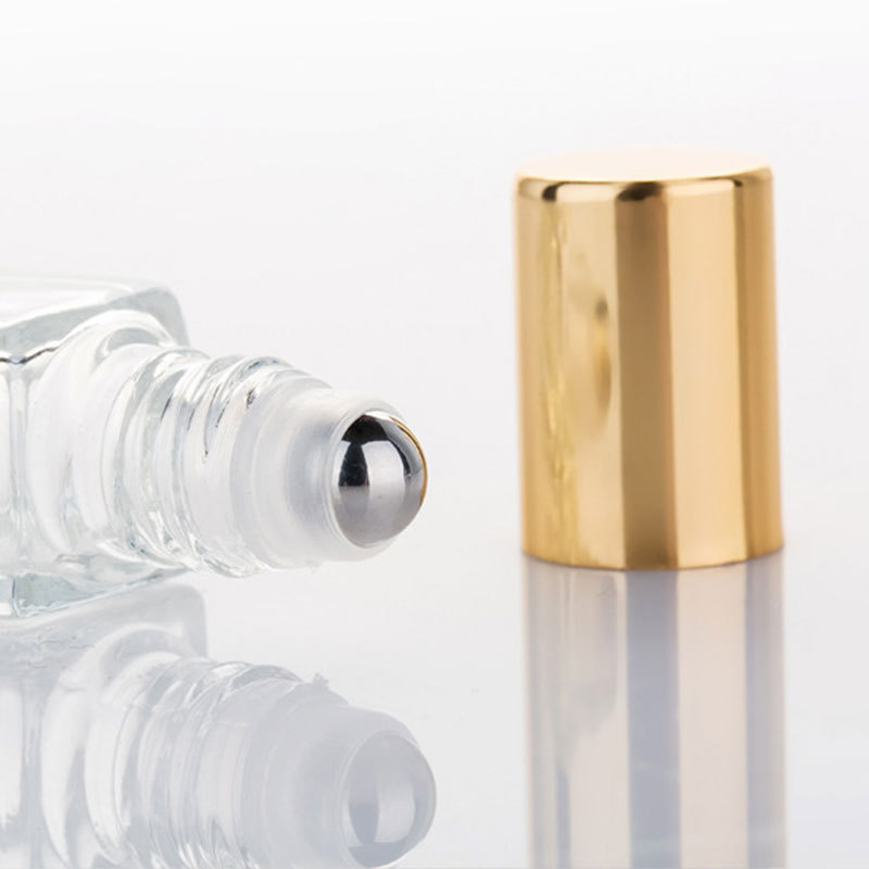 エッセンシャルオイルガラスボトル空のクリアクマ型スチールロー - Perfume Fragrance Liquid のレビューと価格